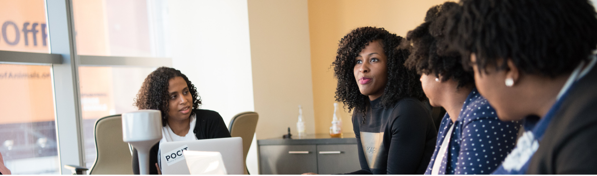 Black Woman Leading A Meeting