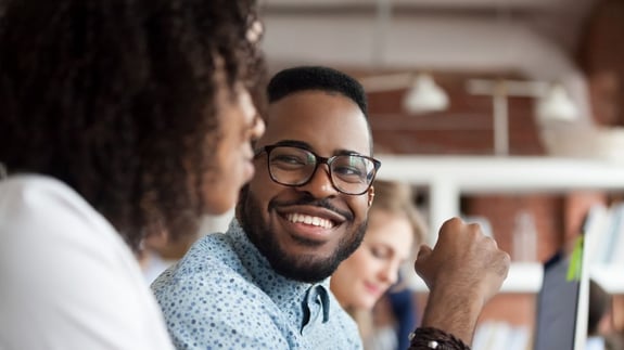 Young black guy chatting with a woman