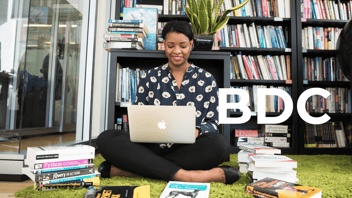 African American woman reading on her laptop 